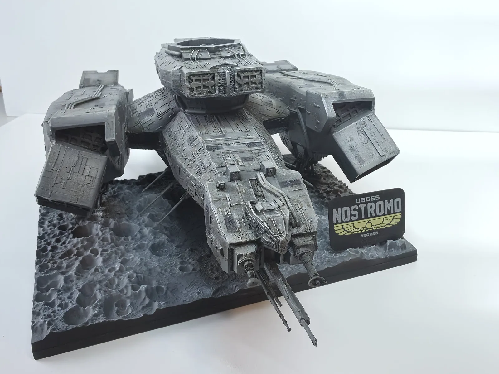 Original front photograph of my cast resin Nostromo model with its rocky base and display nameplate